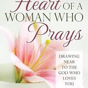 Book cover for 'The Heart of a Woman Who Prays' by Elizabeth George, with a pink lily and the subtitle 'Drawing near to the God who loves you'.